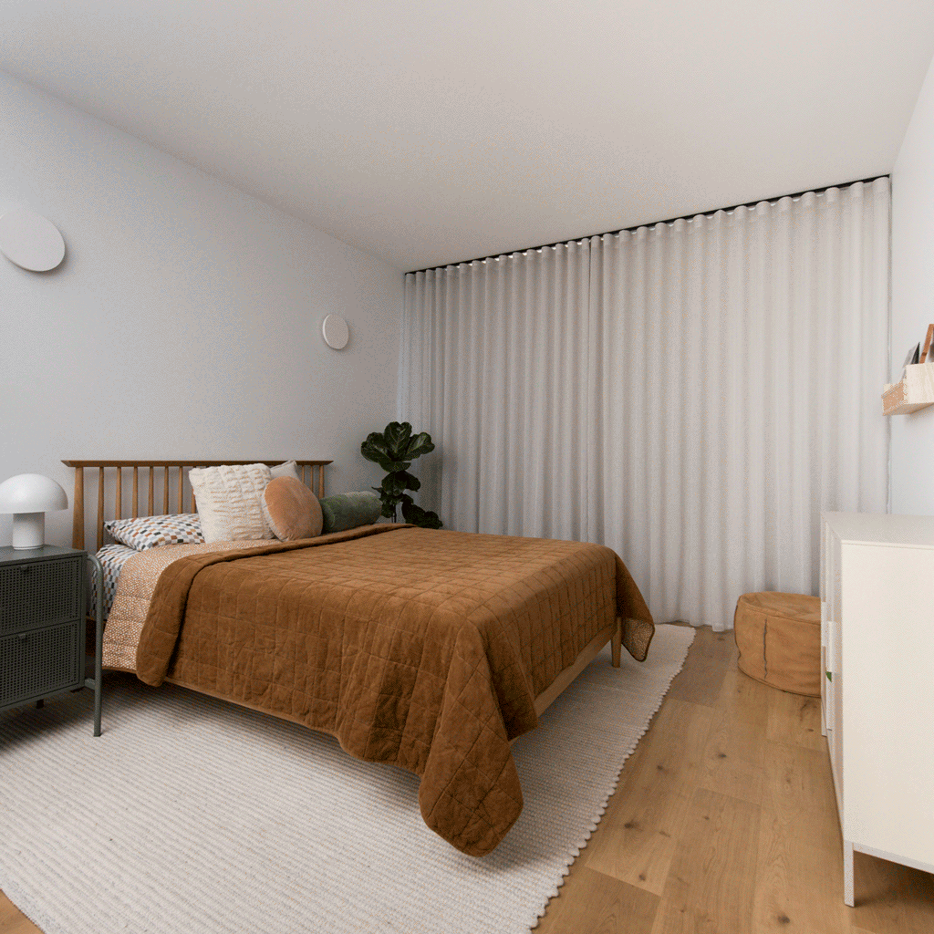 Bedroom with Wave Fold Sheer Curtains and Block Out Roller Blind behind