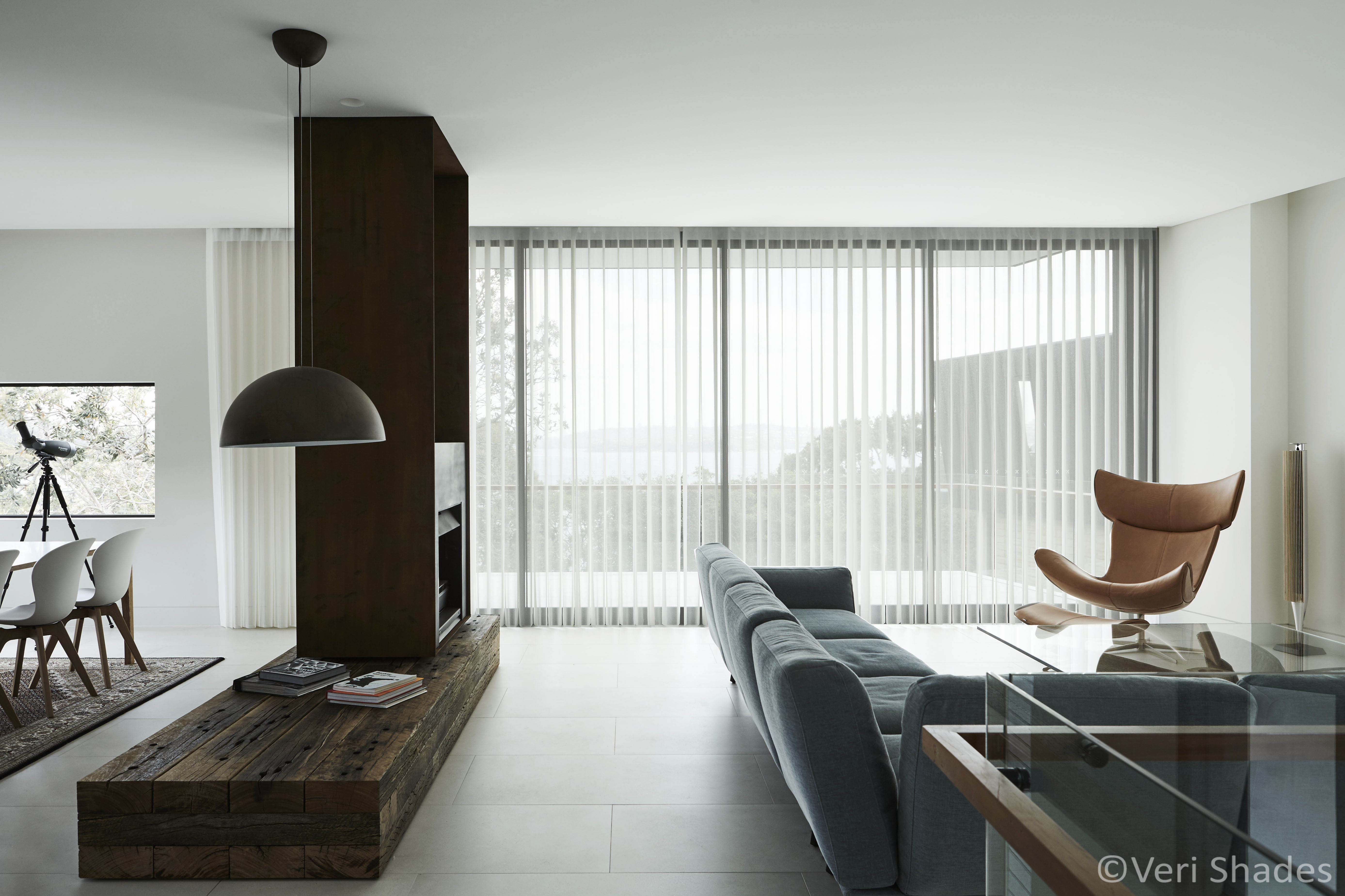 Off-white Veri Shade Blinds covering a floor-to-ceiling window in a modern home