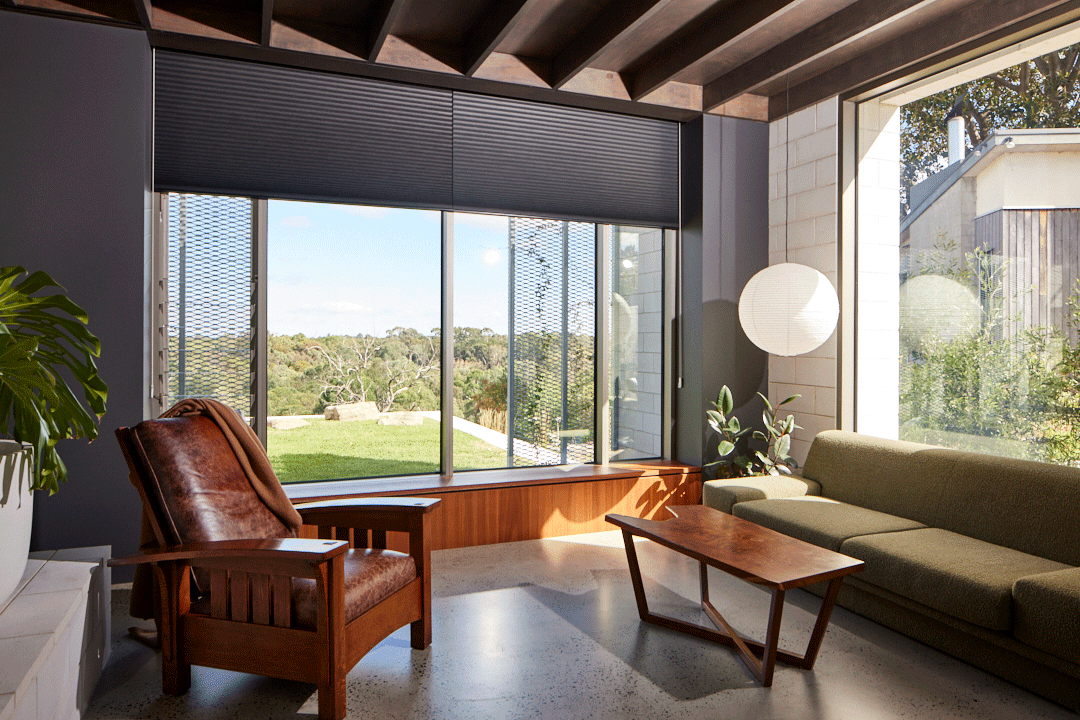 Dark coloured Cellular Blinds showing them open and closed in a modern living area